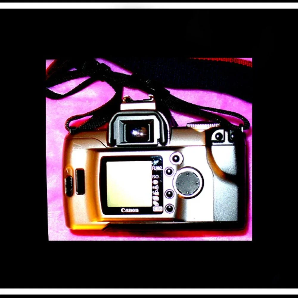 Canon Rebel EOS T2 Photography Camera With An Original Canon Camera Strap